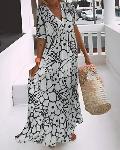 Florivana™ | Dames Maxi Jurk met Bloemenprint | Luchtige Zomerse V-Hals Jurk met Vlindermouwen en Zwierige Pasvorm