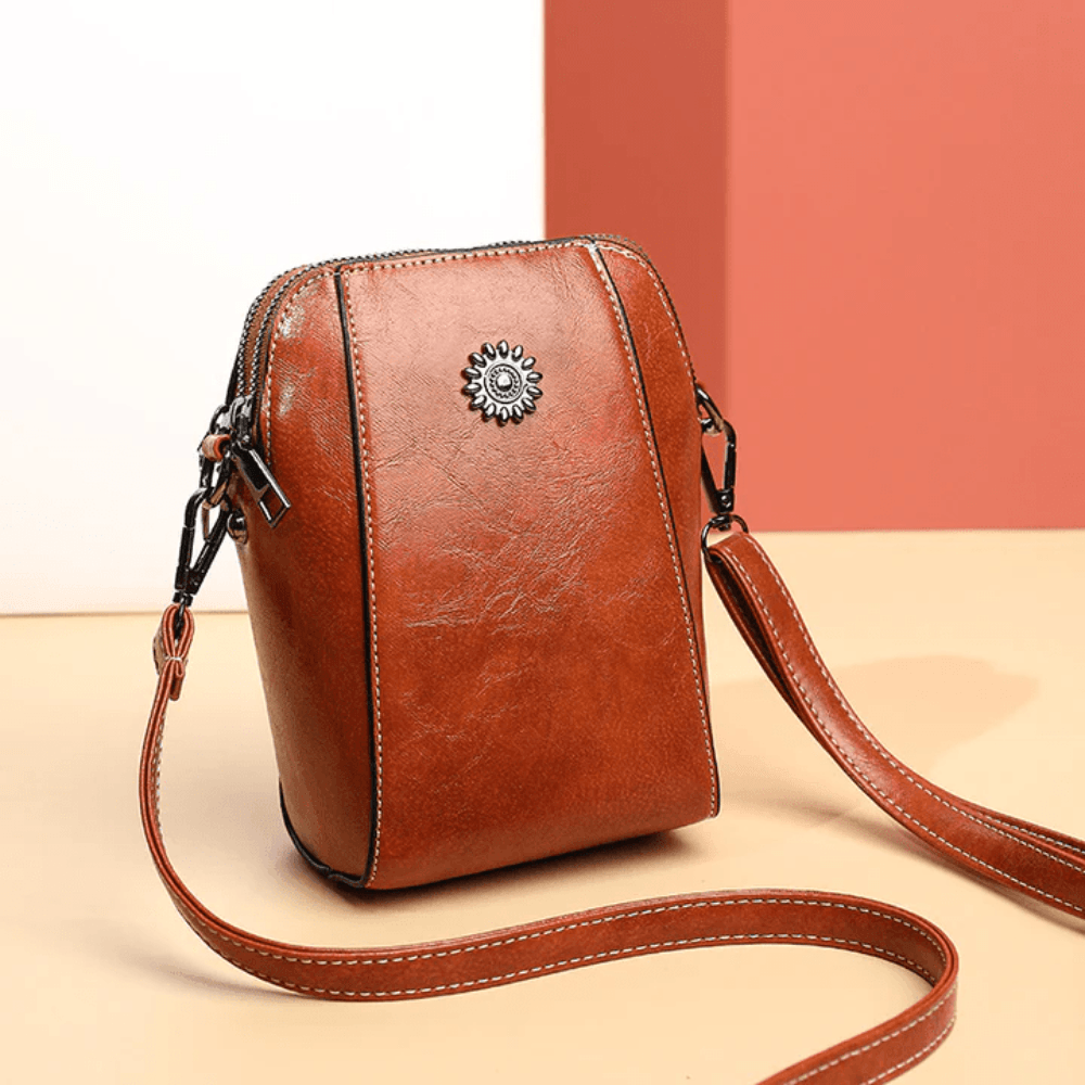 Eloria | Compacte Crossbodytas Met Bloemaccent