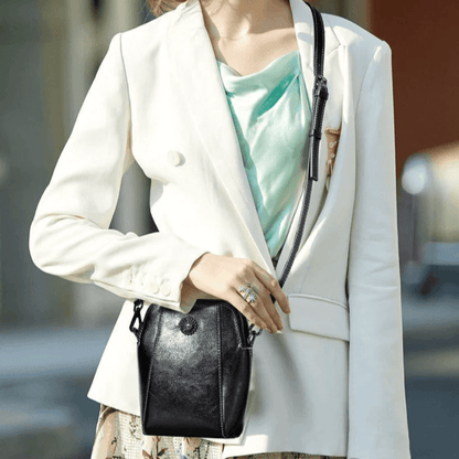 Eloria | Compacte Crossbodytas Met Bloemaccent