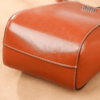 Eloria | Compacte Crossbodytas Met Bloemaccent