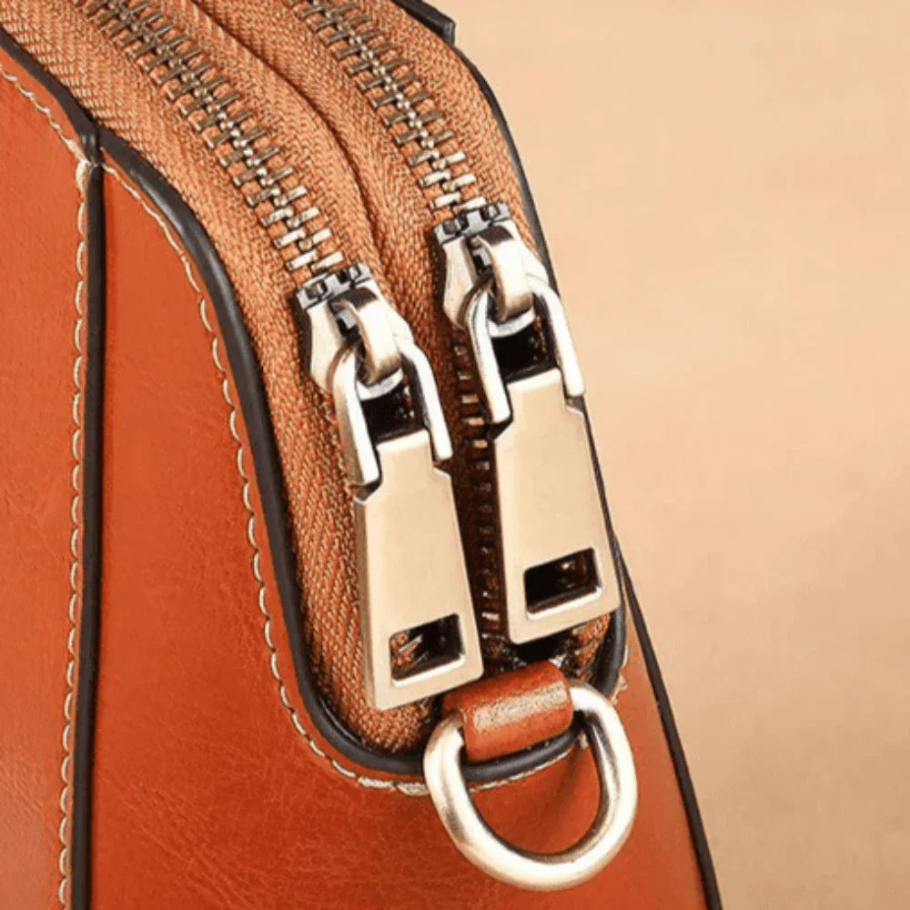 Eloria | Compacte Crossbodytas Met Bloemaccent