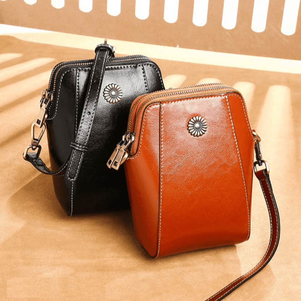Eloria | Compacte Crossbodytas Met Bloemaccent