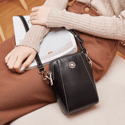 Eloria | Compacte Crossbodytas Met Bloemaccent