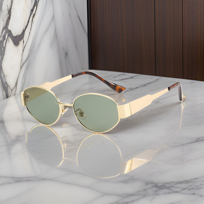 Elisandre™ | Dames Retro Ovale Zonnebril | Luxe Gouden Statement Montuur met UV-Bescherming en Brede Pootjes